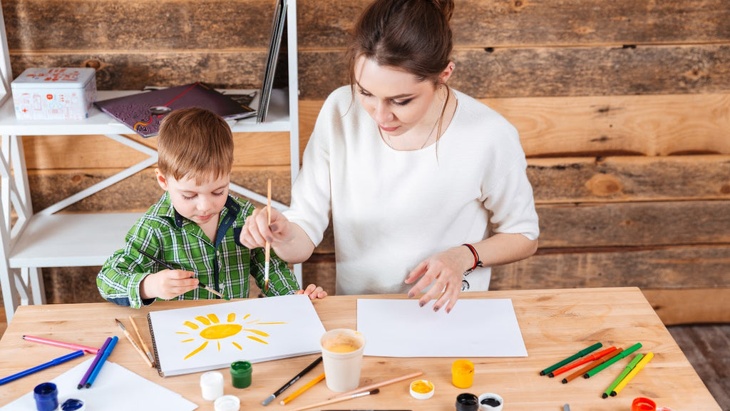 Mom and son painting picture of sun together 4everBound