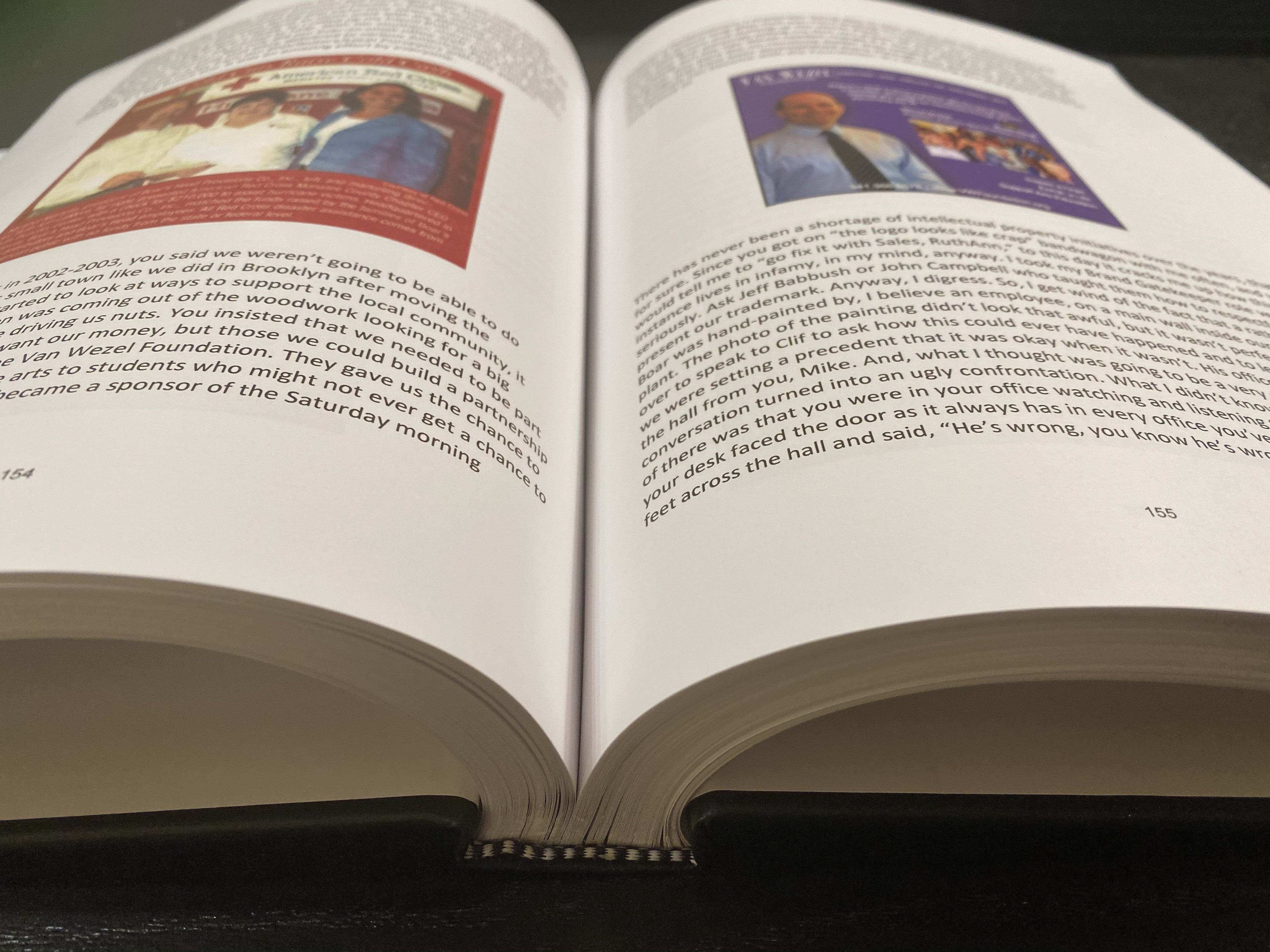 Open custom hardcover book printed and bound by 4everBound from a customer's uploaded file, showing full-color pages with photos and text